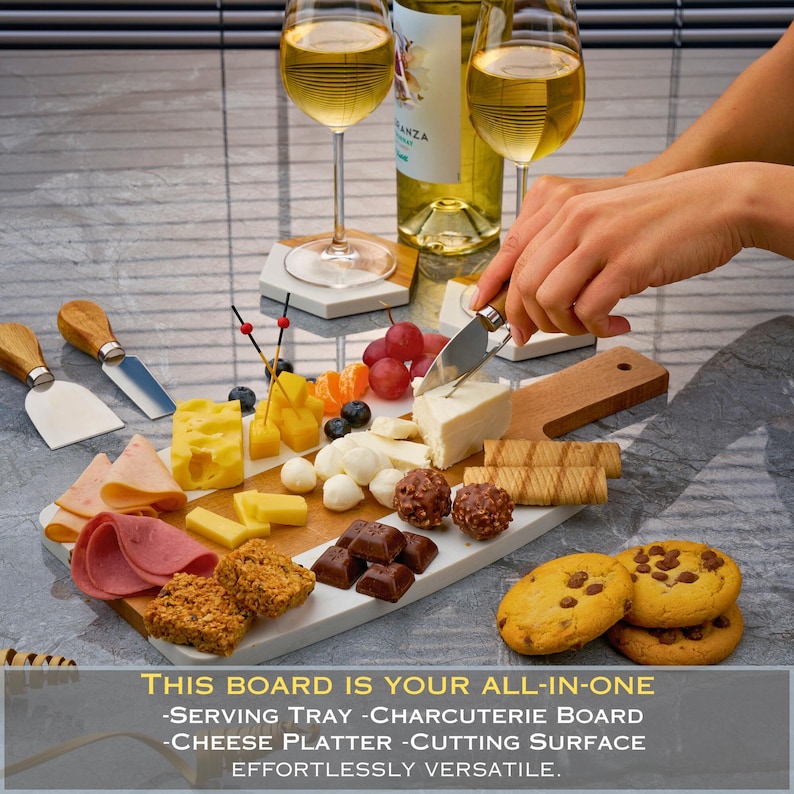 May include: A white marble serving board with a wooden handle, featuring a variety of snacks, including cheese, crackers, fruit, and chocolate. The text "THIS BOARD IS YOUR ALL-IN-ONE -SERVING TRAY -CHARCUTERIE BOARD -CHEESE PLATTER-CUTTING SURFACE EFFORTLESSLY VERSATILE." is printed below the board.