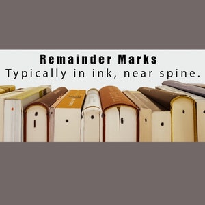 May include: Close-up of a row of books with black ink marks near the spine. The text on the white banner reads "Remainder Marks. Typically in ink, near spine."