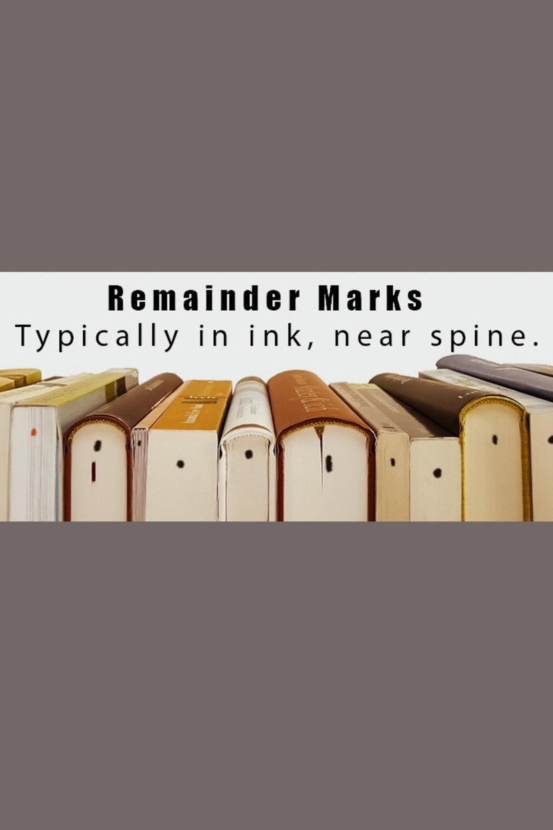 May include: Close-up of a row of books with black ink marks near the spine. The text on the white banner reads "Remainder Marks. Typically in ink, near spine."