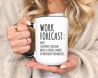 May include: White ceramic mug with black handle and rim. The mug features the text "WORK FORECAST: BUSY. SCATTERED SARCASM WITH A STRONG CHANCE OF MUTTERED PROFANITIES." A humorous and relatable office or home accessory.