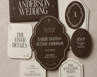 May include: A wedding stationery set featuring a dark brown envelope and cards in cream and brown. The main invitation is a quatrefoil-shaped card with white text reading The Anderson Wedding, Emery Smith & Sutton Anderson, 11.13.2027, and Hotel Drover.