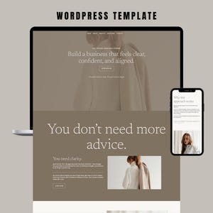 May include: A website design mockup displayed on a laptop and a smartphone. The design is labelled "WORDPRESS TEMPLATE" and features the text: "Build a business that feels clear, confident, and aligned." The design has a neutral colour palette.