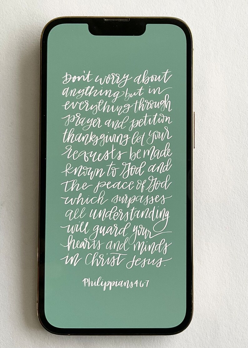 May include: A green phone screen with white text that reads "Don't worry about anything but in everything through prayer and petition thanksgiving let your requests be made known to God and The peace of God which surpasses all understanding will guard your hearts and minds in Christ Jesus. Philippians 4:6-7"