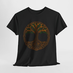 May include: Black t-shirt featuring a brown and green Celtic Tree of Life design. The tree is encircled by a detailed knotwork border. The tree's branches and leaves are green, while the trunk and roots are brown.