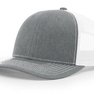 May include: A gray and white trucker hat with a mesh back. The hat has a curved brim and a white stitching detail.