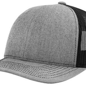 May include: A gray and black trucker hat with a mesh back. The hat has a curved brim and a structured crown.