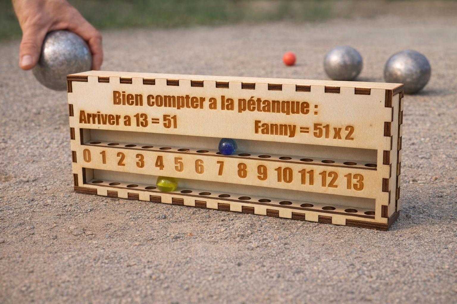 Engraved wooden score counter for pétanque game