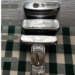 May include: Four silver lighters, one with the text "Zippo" and another with the text "Colibri by Kreisler U.S. Pat. No. 2671328 West-Germany".