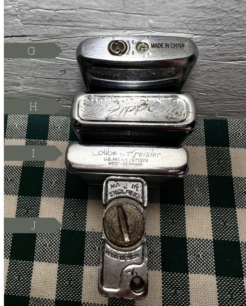 May include: Four silver lighters, one with the text "Zippo" and another with the text "Colibri by Kreisler U.S. Pat. No. 2671328 West-Germany".