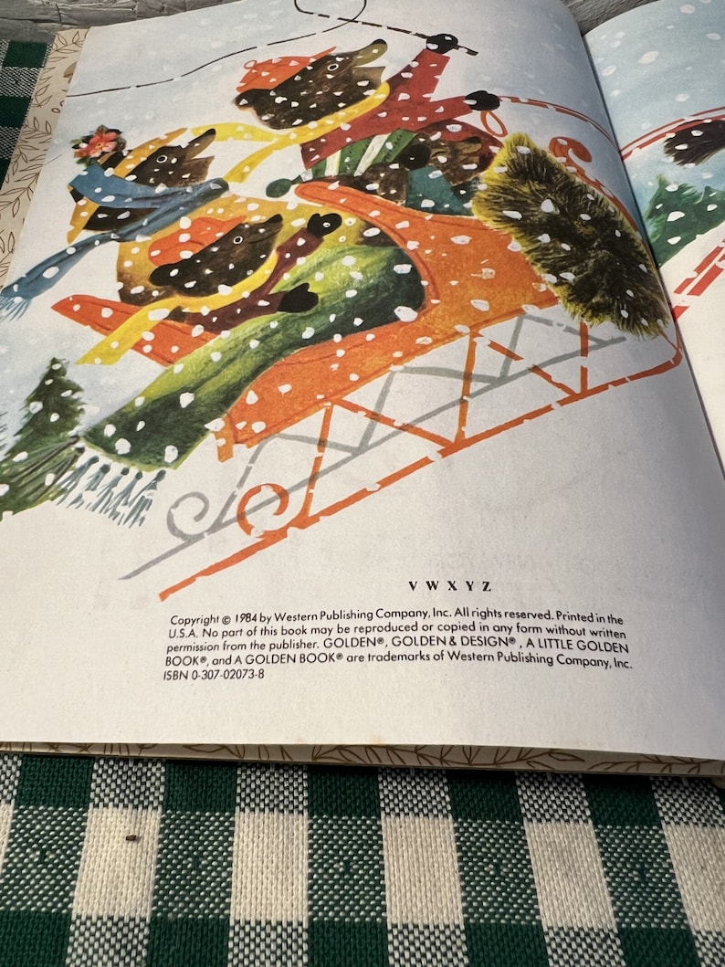 May include: A vintage children's book illustration of three bears riding in a red sledge through a snowy forest. The book is titled "A Little Golden Book" and includes the copyright information "Copyright &copy; 1984 by Western Publishing Company, Inc. All rights reserved. Printed in the U.S.A."