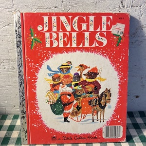 May include: A vintage Little Golden Book titled "Jingle Bells" with a red cover featuring a colourful illustration of Santa Claus and animals riding in a sleigh. The book has a price tag of &pound;0.80.