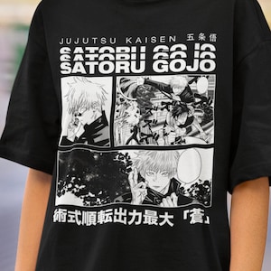 May include: Black t-shirt featuring manga-style illustrations and text. The design includes the words "JUJUTSU KAISEN" and "SATORU GOJO" in white, along with Japanese characters and manga panels. The shirt is a short-sleeved, crew neck style.