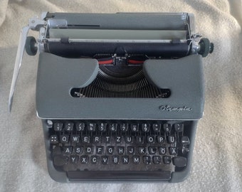 1950s Olympia SM2 typewriter made in Germany, vintage and portable typewriter for writers in good working condition, qwertz.
