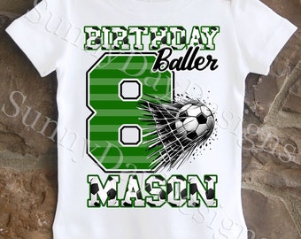 May include: White t-shirt with a green number 8, a soccer ball going into the net, and the text "Birthday Baller Mason".