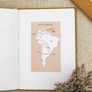 May include: A black and white outline map of South America with the names of each country labeled. The map is on a light pink background.