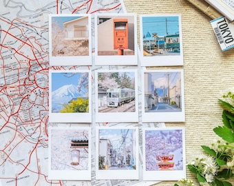 May include: Nine instant photos of various scenes in Japan, including a red post box, a train, a mountain, and cherry blossoms.