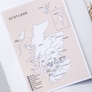 May include: A black and white map of Scotland with the names of the regions labeled. The map shows the location of Edinburgh, the capital city of Scotland.