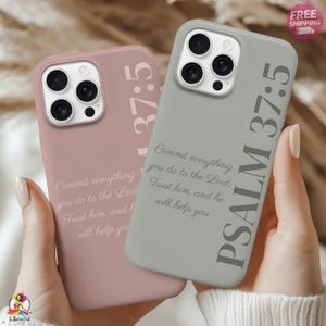 May include: Two phone cases, one dusty rose and one sage green, are displayed. Each case features the text "PSALM 37:5" and a quote. The cases are designed to fit a smartphone and have camera cutouts.