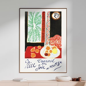 May include: A colorful painting by Henri Matisse titled "Nice Travail Joie" featuring a still life of fruit on a red tablecloth with a window and a green plant in the background.