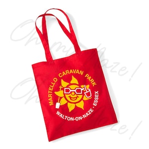 May include: Red canvas tote bag with a white logo featuring a yellow sun wearing sunglasses and holding a drink. The logo reads "Martello Caravan Park Walton-on-Naze Essex."