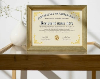 May include: A framed certificate of appreciation with gold accents. The certificate has text that reads "Certificate of Appreciation" and "Recipient name here". The frame is a light gold color.