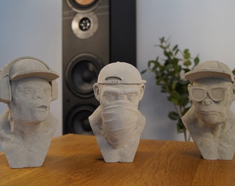 Handcrafted concrete monkey head sculpture in the style of the three wise monkeys - modern art for business