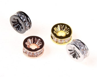 Peut inclure: Quatre espaceurs de perles ronds en métal avec des accents de cristal transparent. Les espaceurs sont en noir, or, or rose et argent.