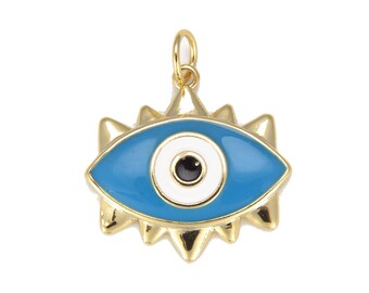 Puede incluir: Encanto de oro con un diseño de ojo azul malvado. El ojo está rodeado de blanco y tiene una pupilla negra.