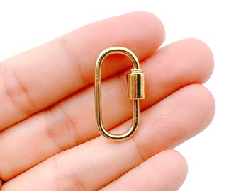 May include: Gold-toned metal lobster clasp with a swivel. The clasp is oval-shaped and has a smooth, polished finish.