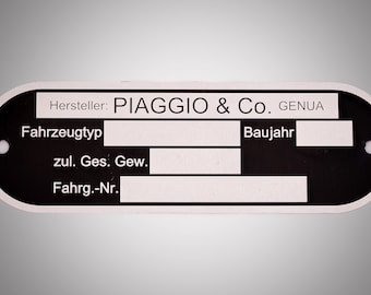 May include: Black and white metal tag with the text "Hersteller: PIAGGIO & Co. GENUA" and blank fields for "Fahrzeugtyp", "zul. Ges. Gew.", "Fahrg.-Nr.", and "Baujahr".