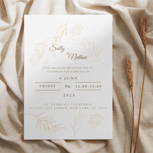 May include: A wedding invitation featuring the names "Sally & Nathan". The invitation includes the date, time, and location: St. Patrick's Cathedral, New York. The design incorporates botanical illustrations in a soft, neutral colour palette.
