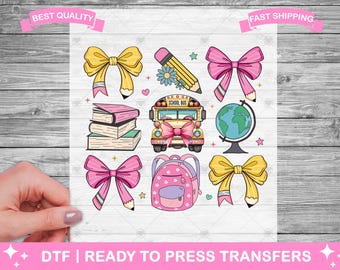 May include: A set of nine iron-on transfers featuring school-themed illustrations. The designs include a yellow school bus, a globe, books, pencils, and bows in pink and yellow.