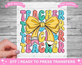 May include: A colorful graphic design featuring the word "Teacher" repeated multiple times. A yellow pencil with a bow tied around it is in the center of the design.