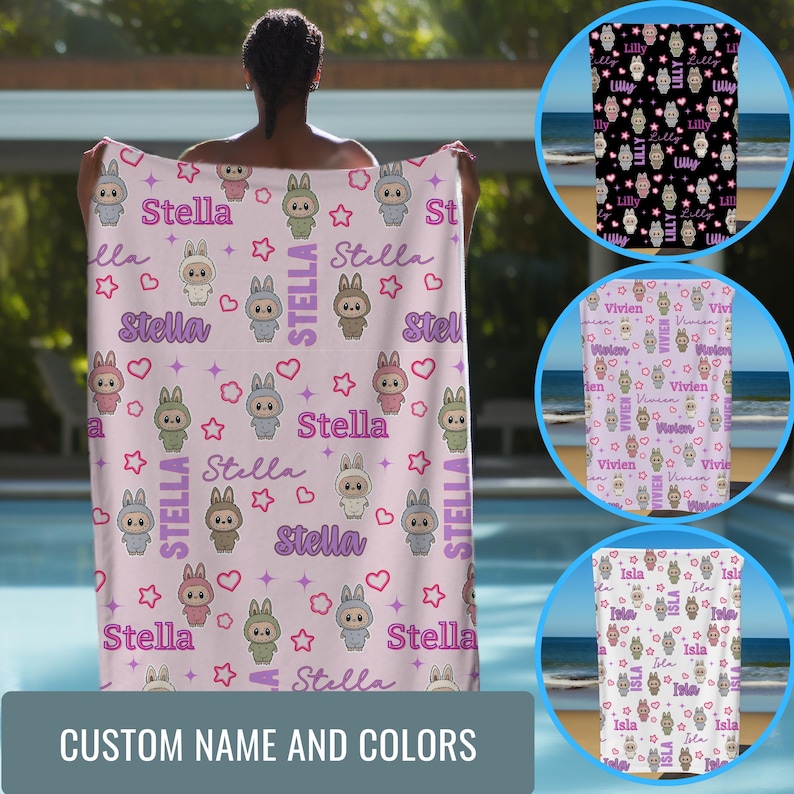 May include: A light pink personalized towel featuring a repeating pattern of cartoon bunnies, stars, and hearts. The name "Stella" is displayed throughout the design. The towel also has the text "CUSTOM NAME AND COLORS".