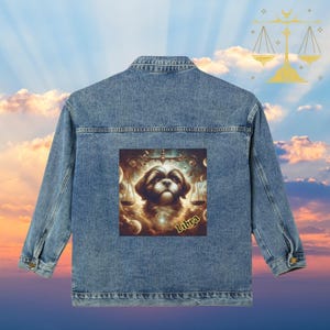 May include: A light blue denim jacket featuring a Libra-themed graphic. The graphic depicts a dog with a scale and the word "Libra". The jacket has a classic design with button closures and pockets.