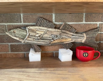 Fish wall display made from driftwood. Hooks on back for mounting. Measures approx 25 inches x 10 inches.