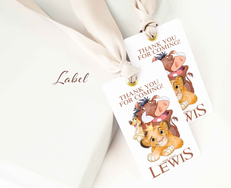 May include: Two white thank you tags with a lion king theme. The tags feature Simba, Pumbaa, and Timon. The text on the tags reads "Thank you for coming!" and "The King Lewis".