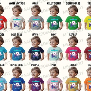 May include: A set of 18 toddler t-shirts in various colors featuring a cartoon spider-man design and the name "Hannah".