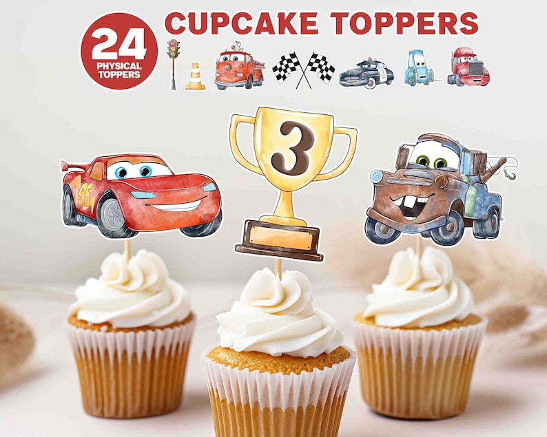 May include: 24 Cars themed cupcake toppers, featuring a red race car, a blue tow truck, a trophy with the number 3, and a traffic light. The toppers are on top of cupcakes with white frosting.