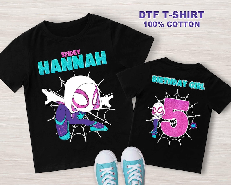 May include: Two black t-shirts with a white spider-woman graphic. The larger shirt says "SPIDEY HANNAH" and the smaller shirt says "BIRTHDAY GIRL" with the number 5.