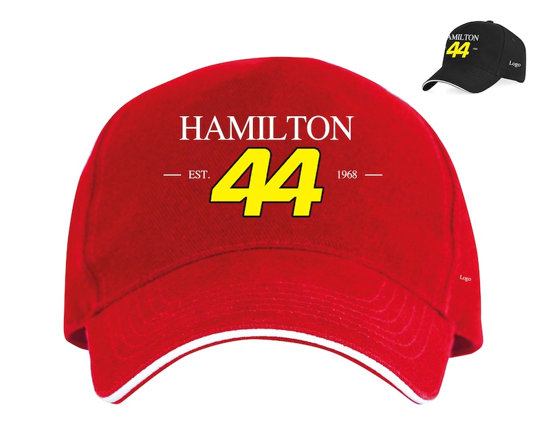 May include: Red baseball cap with a white brim and a white logo that says "HAMILTON EST. 44 1968" in yellow lettering.