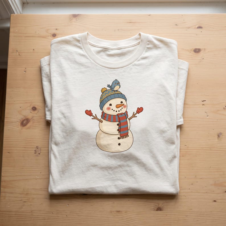 Winter Snowman clipart design printed on a shirt, as an example