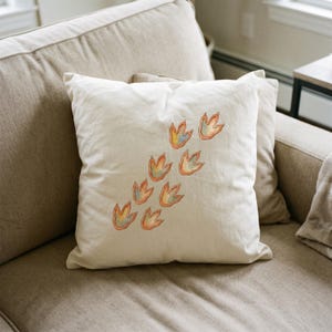 Cute Dinosaur clipart design printed on a pillow, as an example