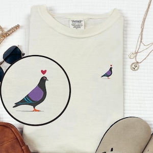 Tiny Pigeon Embroidered T-Shirt | Unisex Comfort Colors Cotton Tee | Bird Lover Gift | Pocket Placement Pigeon Shirt