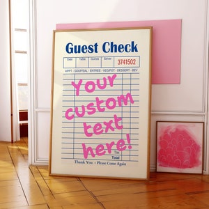 May include: A framed guest check with a white background and black lines. The text "Guest Check" is in blue. The text "Your custom text here!" is in pink. The text "Date", "Table", "Guests", "Server", "3741502", "APPT", "SOUPISAL", "ENTREE", "VEG/POT", "DESSERT", "BEV", "Tax", "Total", "Thank You - Please Come Again" is in black.