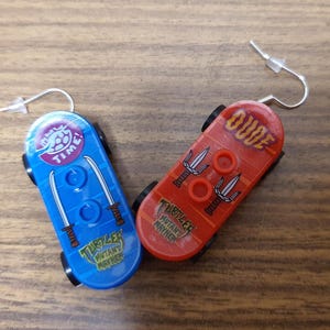 Teenage Mutant Ninja Turtles Raphael and Leonardo skateboards minifigure earrings.