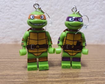 Teenage Mutant Ninja Turtles Donatello and Michelangelo minifigure earrings.