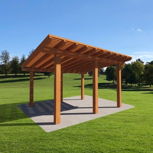 May include: A wooden pergola with a flat roof and four supporting beams. The pergola is set on a grassy lawn with trees in the background.