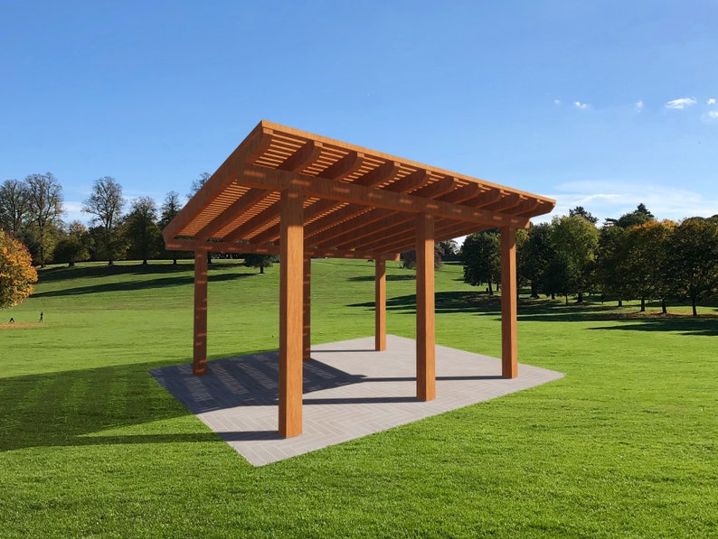 May include: A wooden pergola with a flat roof and four supporting beams. The pergola is set on a grassy lawn with trees in the background.