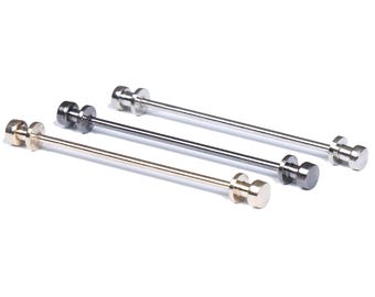 May include: Three tie bars in different finishes: gold, silver, and black. Each tie bar has a cylindrical shape with rounded ends.